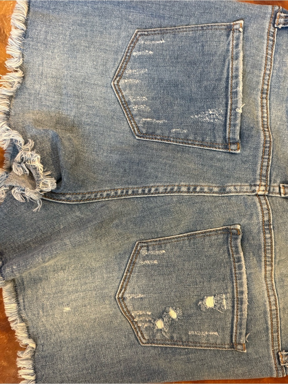 Women’s Light Blue Distressed Denim Jean Shorts with Frayed Hem
